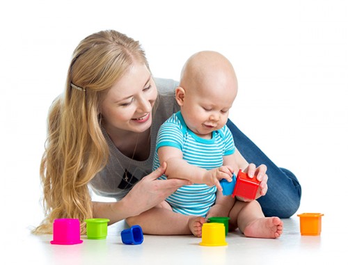 baby and mom playing with toys