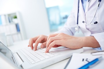 Medical professional on laptop