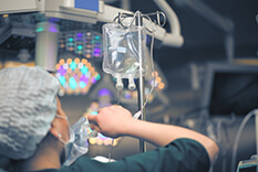 nurse with IV bag